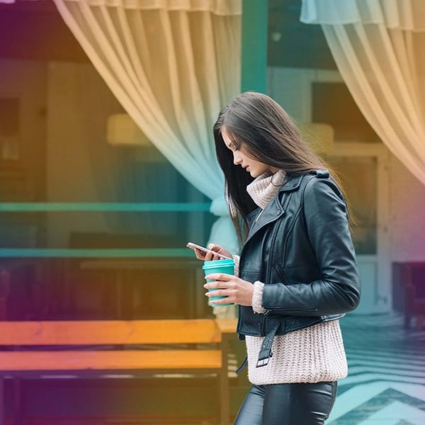 squared_woman_walking_phone