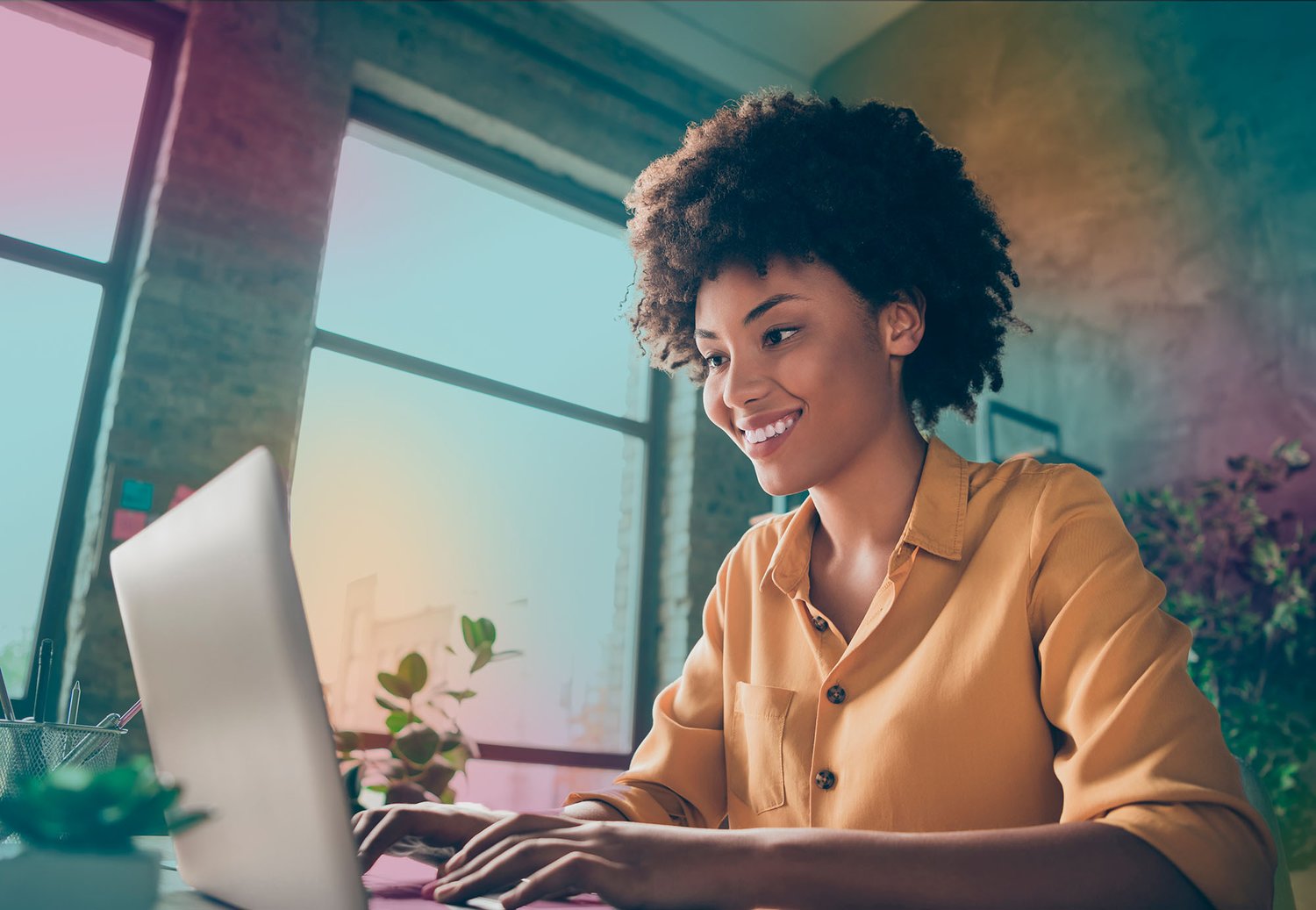 smiling_woman_looking_at_laptop