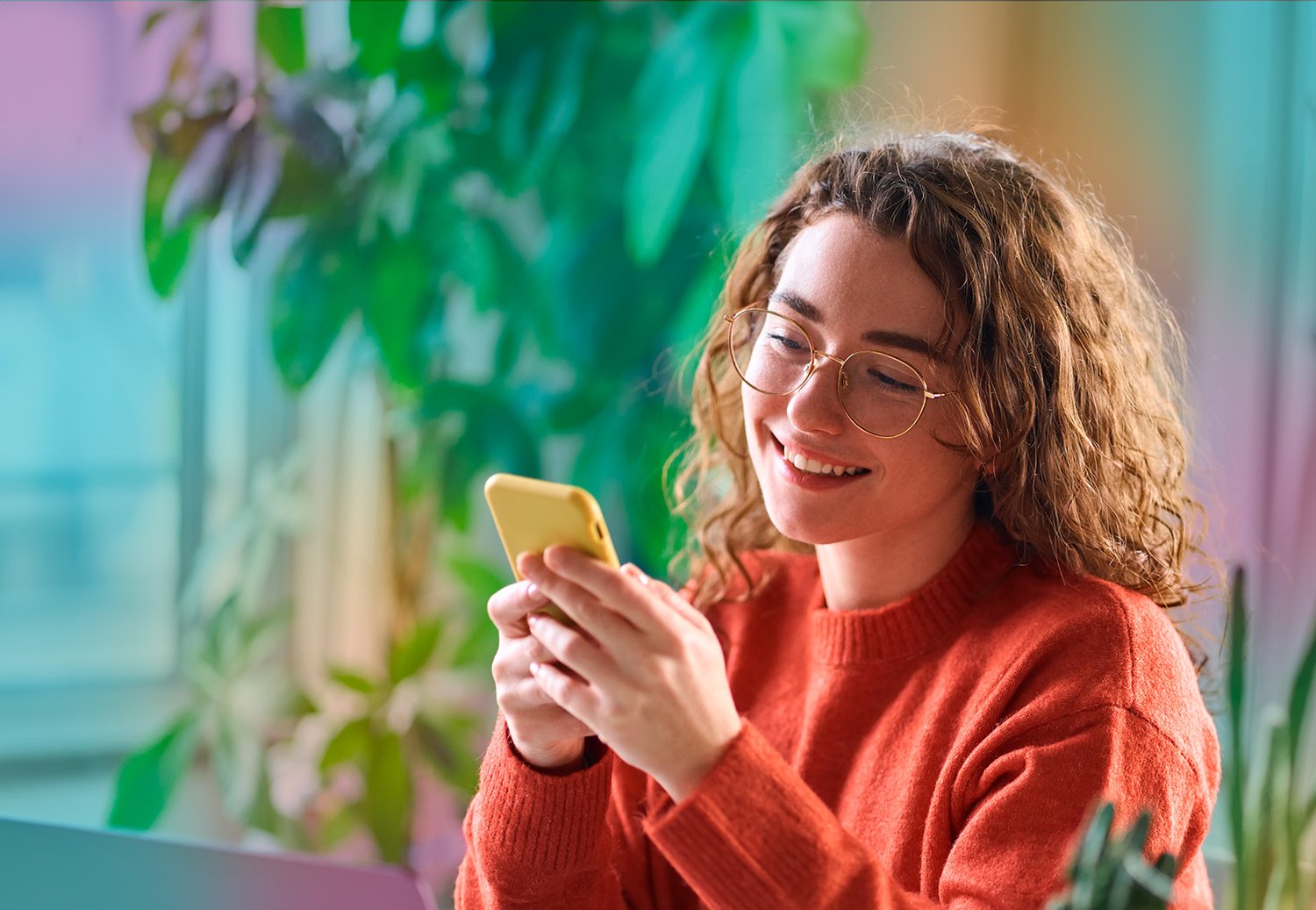 woman_with_phone_surrended_by_plants