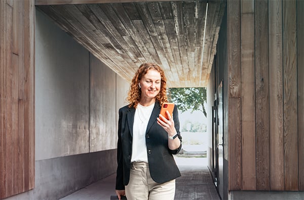 outside-woman-caucasian-mobile-suitcase-walking-squared