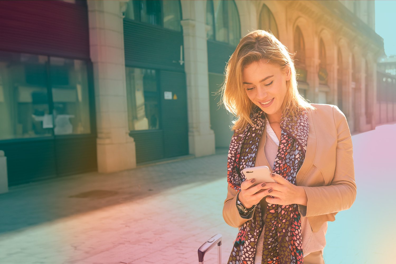 blond_woman_outdoor_looking_at_her_phone