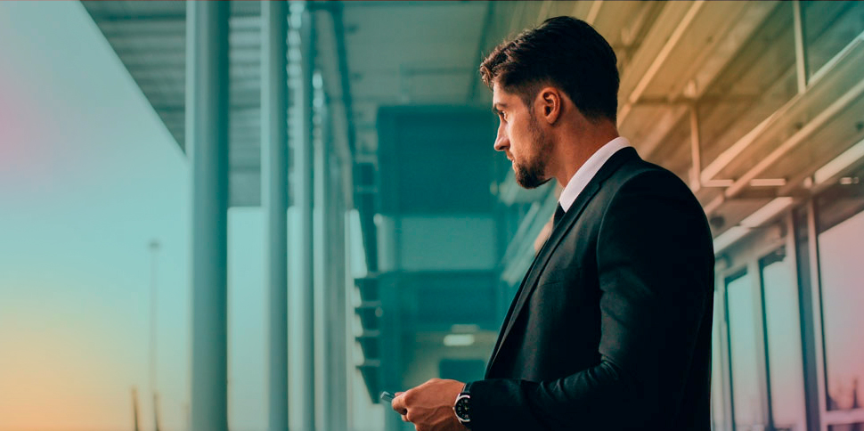 man_with_phone_at_airport