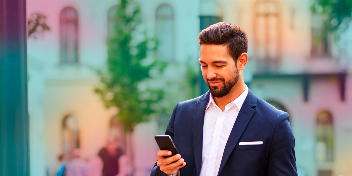man_with_phone_in_street